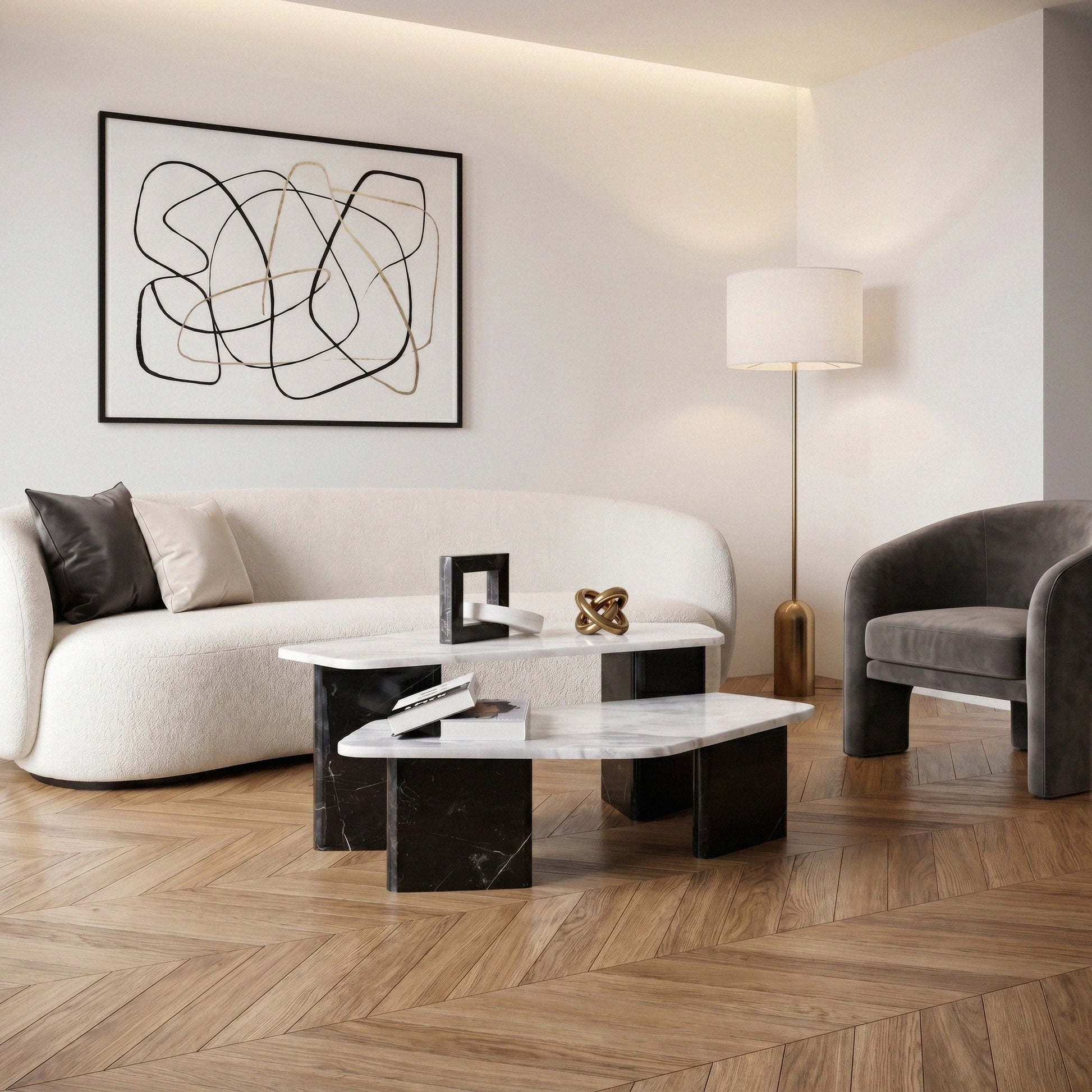 Meri Marble Coffee Table Set in a living room with parquet flooring, ivory colored Sofa, dark gray armchair and floor light stand at the corner 