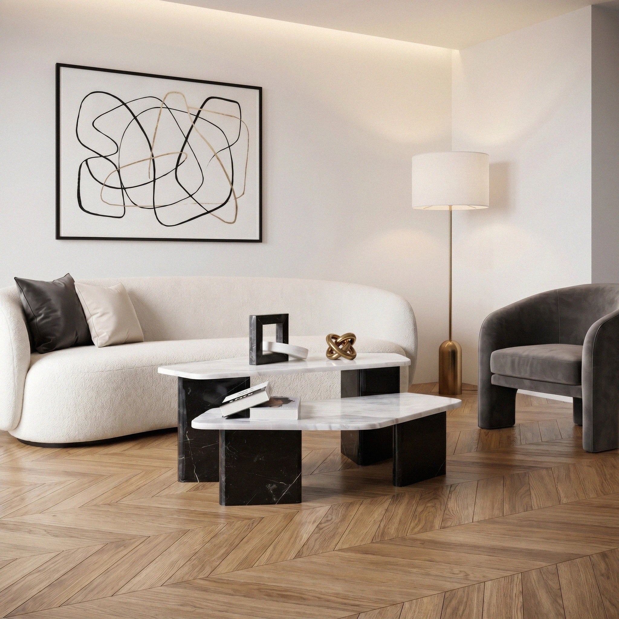 Meri Marble Coffee Table Set in a living room with parquet flooring, ivory colored Sofa, dark gray armchair and floor light stand at the corner 