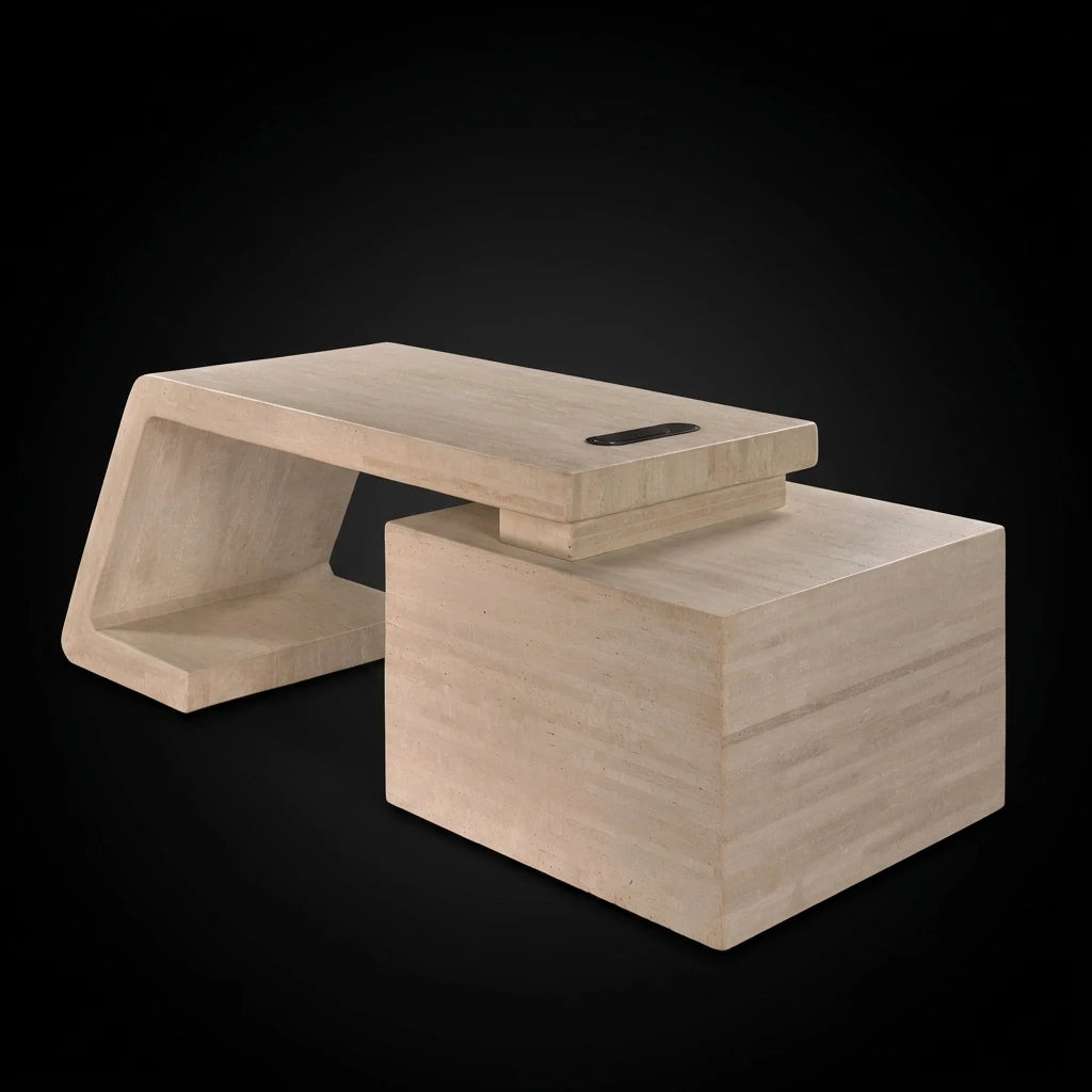 A minimalist modern natural stone office table with beige travertine finish, featuring a geometric angular base, hidden drawers storage and a floating rectangular top with integrated power hub with a built-in wireless charging pad, set against a solid black background.